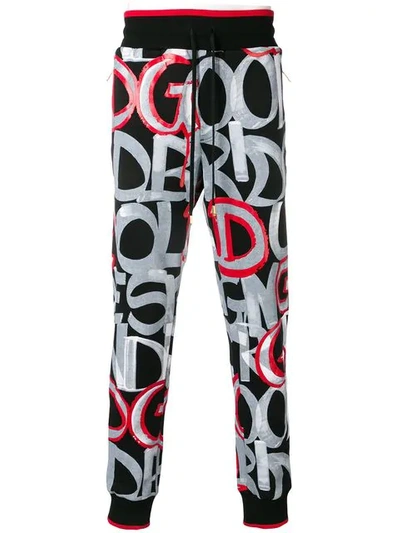 Shop Dolce & Gabbana Bold Lettering Trousers In Black