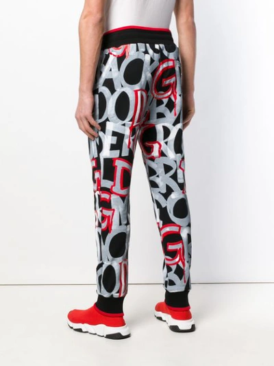 Shop Dolce & Gabbana Bold Lettering Trousers In Black