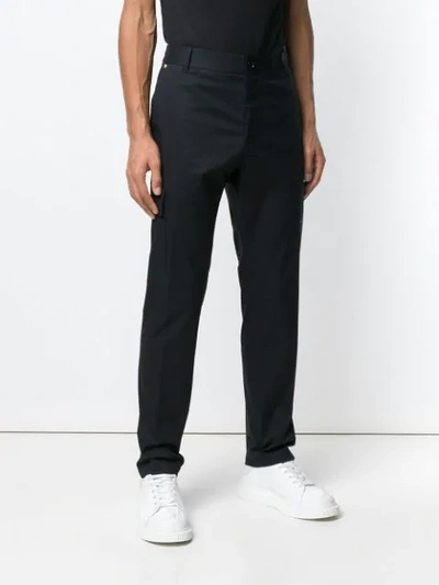 Shop Versace High Waisted Straight Leg Trousers In Black