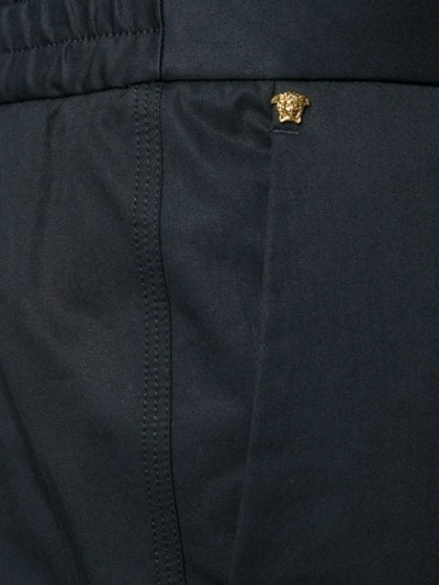 Shop Versace High Waisted Straight Leg Trousers In Black