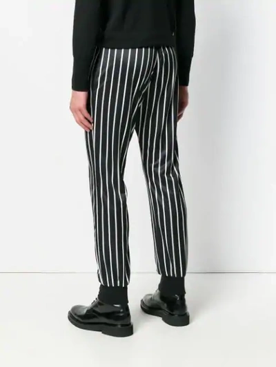 Shop Versace Striped Printed Track Trousers In Black