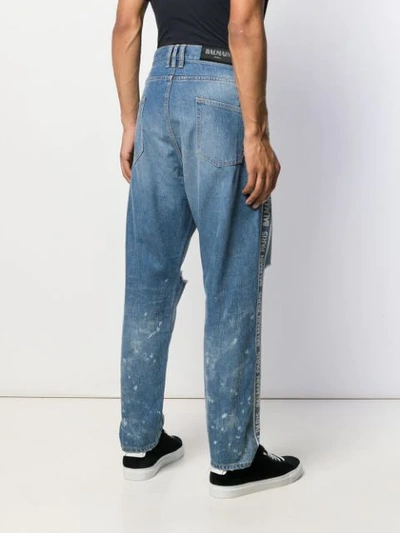 Shop Balmain Loose Fit Logo Jeans In Blue