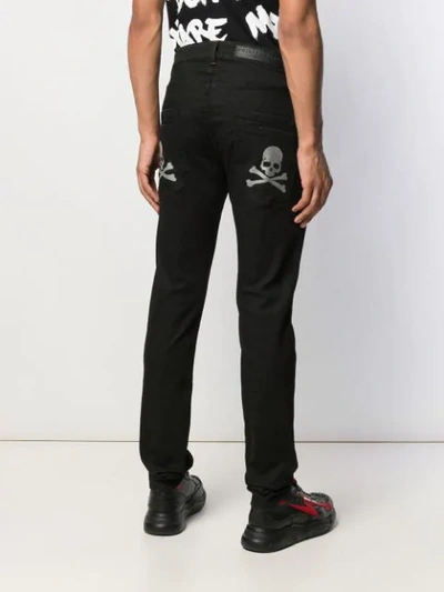 Shop Philipp Plein Slim Fit Jeans With Skull Print - Black