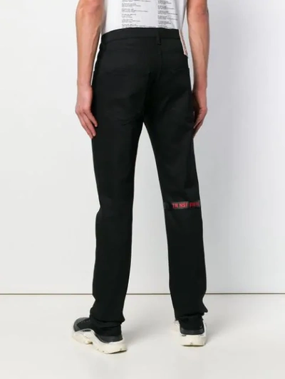Shop Raf Simons Slim-fit Jeans In Black