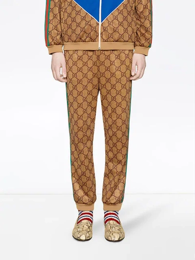 Shop Gucci Gg Supreme Print Cotton Blend Sweat Pants In Brown