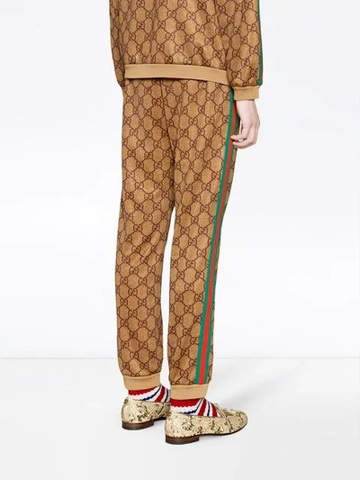 Shop Gucci Gg Supreme Print Cotton Blend Sweat Pants In Brown