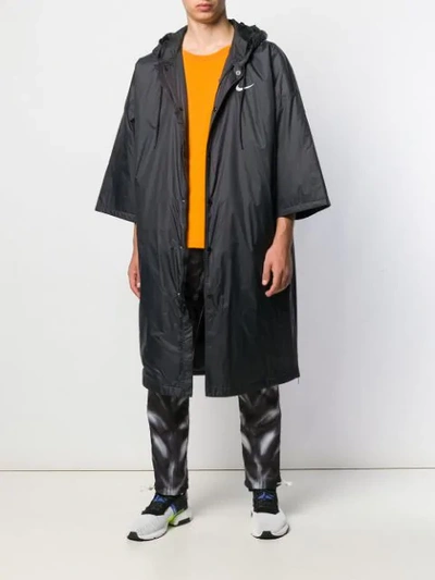 Shop Nike Raincoat In Black