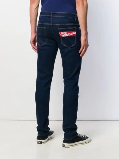 Shop Love Moschino Logo Regular Jeans In Blue