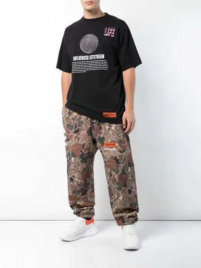 Heron Preston Ctnmb Leaf-print Cotton-jersey Track Pants In Brown