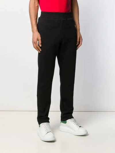 Shop Versace Heart Logo Embroidered Track Pants In Black