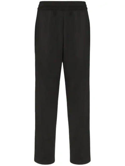 Shop Moschino Logo-stripe Track Pants In Black