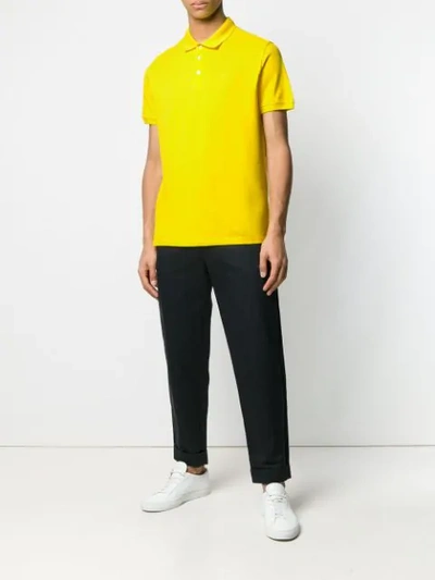 Shop Emporio Armani Geripptes Poloshirt In Yellow