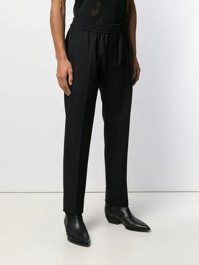 Shop Givenchy Vertical Logo Jogger Pants In Black