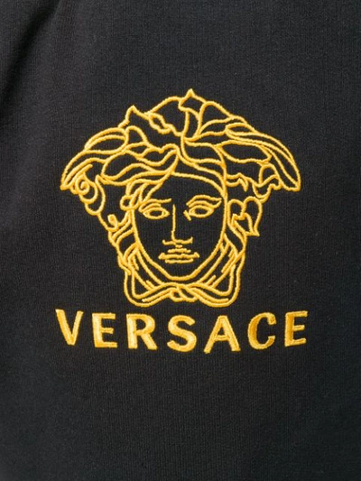 Shop Versace Gold-tone Logo Track Pants In Black