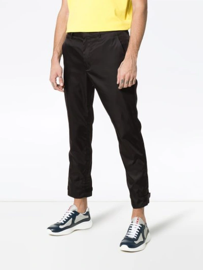 Shop Prada Strap Cuff Trousers - Black