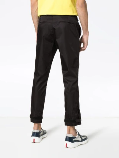Shop Prada Strap Cuff Trousers - Black