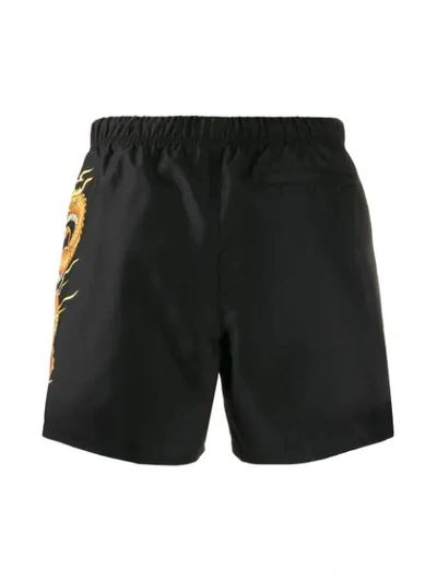 Shop Versace Dragon Motif Swim Shorts In Black