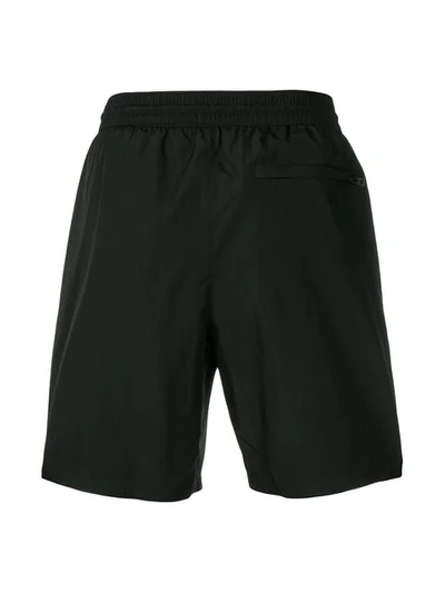 Shop Burberry Striped Swim Shorts In Black
