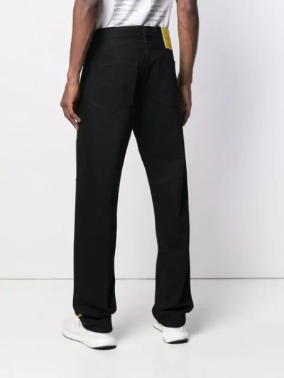 Shop Calvin Klein Jeans Est.1978 Super Size Jeans In 911 Black Yellow