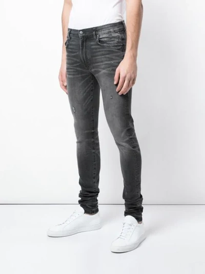 Shop Amiri Washed Effect Skinny Jeans In Grey