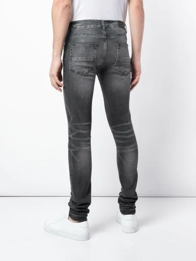 Shop Amiri Washed Effect Skinny Jeans In Grey