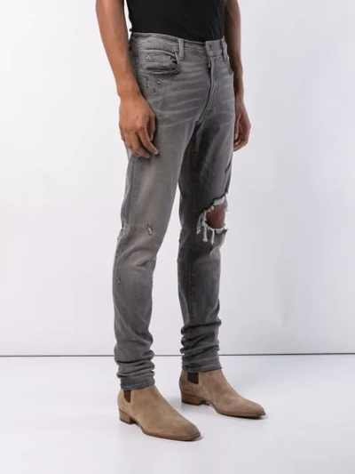 Shop Amiri Distressed Jeans In Grey