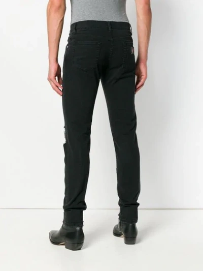 Shop Dolce & Gabbana Ripped Skinny Jeans - Black