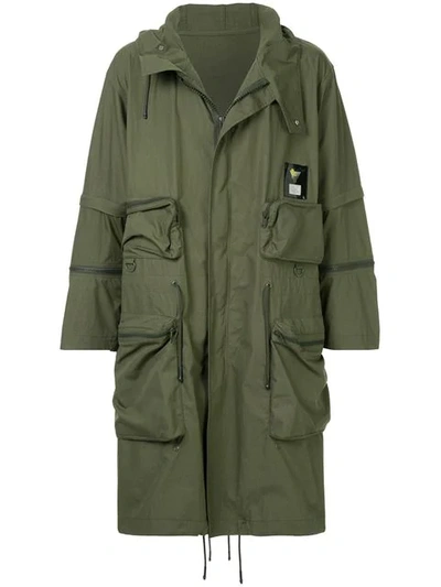 Shop Undercover Graphic Raincoat In Green