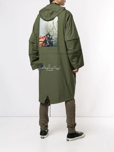 Shop Undercover Graphic Raincoat In Green