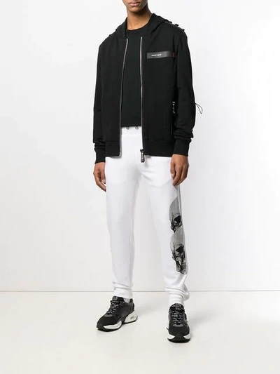 Shop Philipp Plein Side Skulls And Logo Track Pants In White