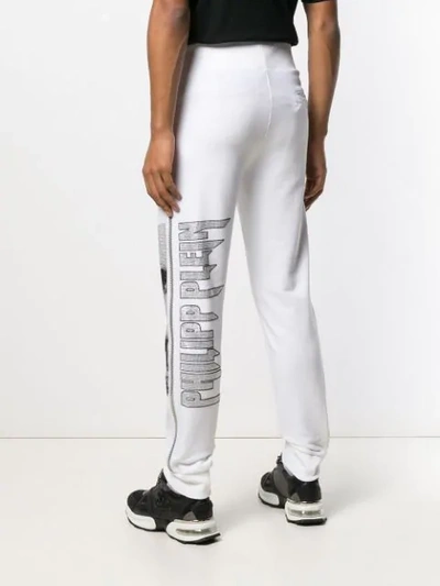 Shop Philipp Plein Side Skulls And Logo Track Pants In White
