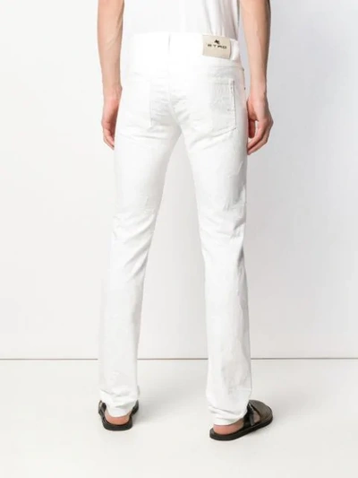 Shop Etro Slim Fit Trousers In White