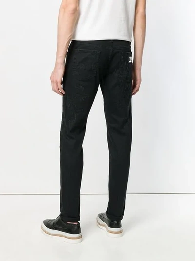 Shop Dolce & Gabbana Distressed Straight Leg Jeans In Black