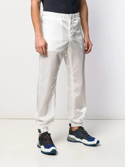 Shop Prada Tapered Elasticated Trousers In White