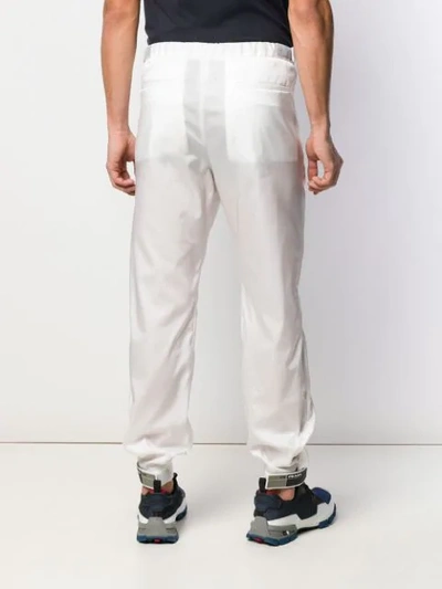 Shop Prada Tapered Elasticated Trousers In White