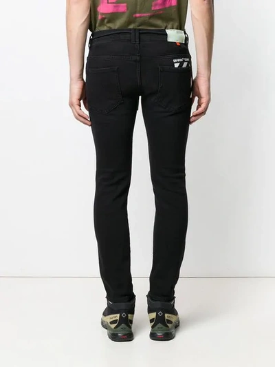 Shop Off-white Low Rise Skinny Jeans In Black