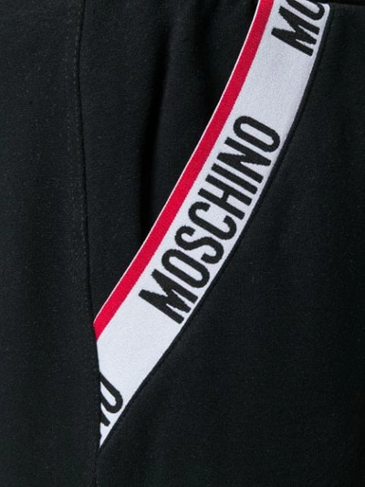 Shop Moschino Branded Track Pants In Black