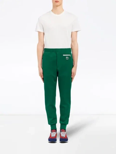 Shop Prada Technical Jersey Trousers In Green