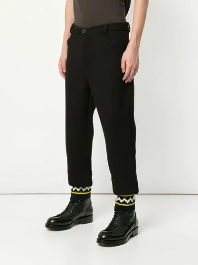 Shop Geym Zig Zag Cuff Trousers In Black