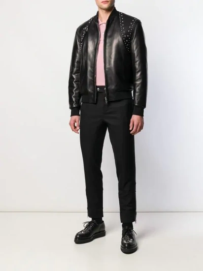 Shop Alexander Mcqueen Studded Harness Bomber Jacket In Black