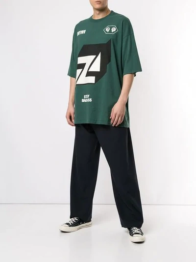 Shop Undercover Oversized Graphic T-shirt In Green