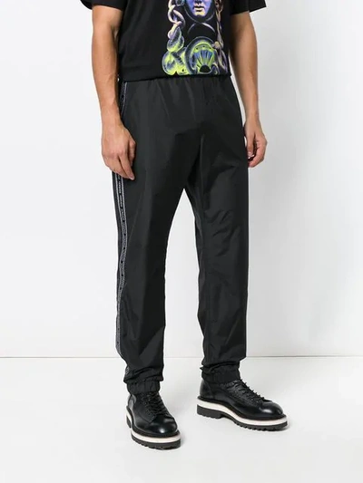 Shop Versace Side-stripe Track Pants In Black