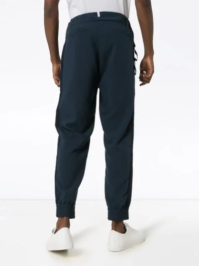 Shop Lot78 Crepe Tape Detail Track Pants In Blue