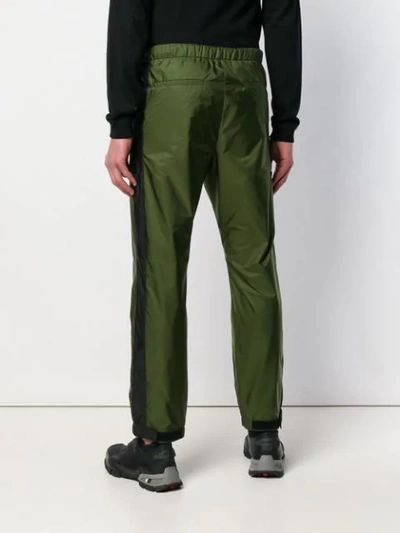 Shop Prada Logo Cuff Trousers In Green