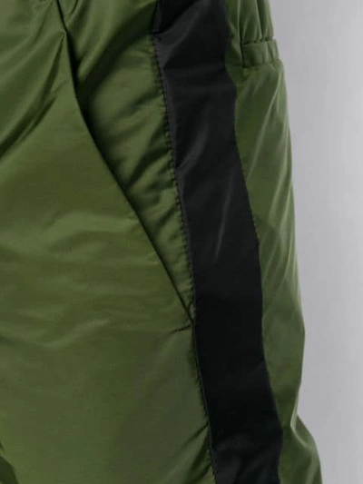 Shop Prada Logo Cuff Trousers In Green