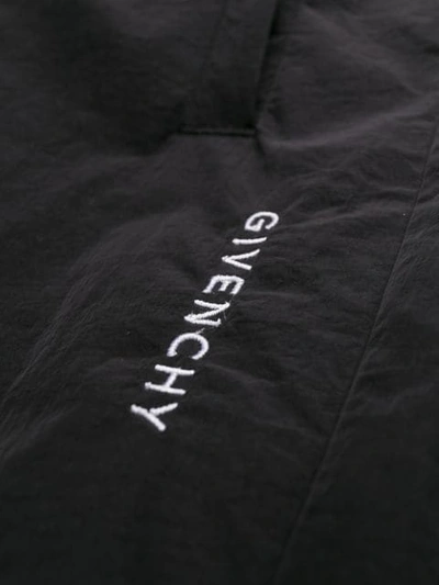 Shop Givenchy Logo Track Pants In Black