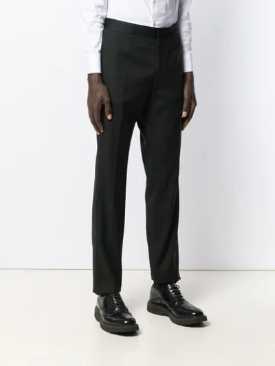 Shop Versace Slightly Cropped Tailored Trousers In Black