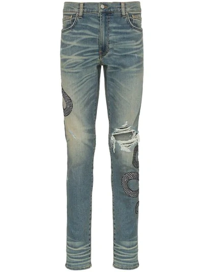 Shop Amiri Snake Embroidered Distressed Jeans In Indwh