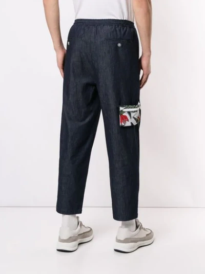 Shop Yoshiokubo Denim Tuck Trousers In Blue