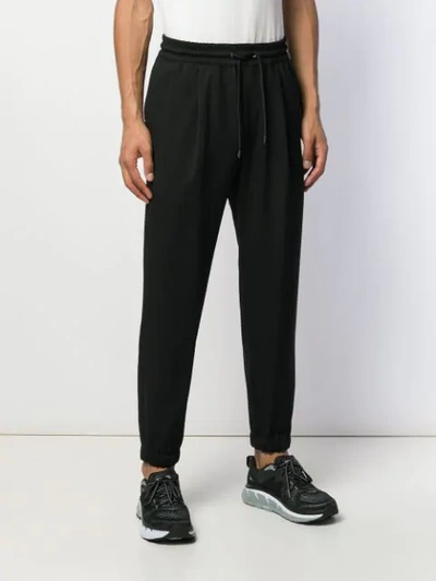 Shop Mcq By Alexander Mcqueen Athleisure Track Pants In Black